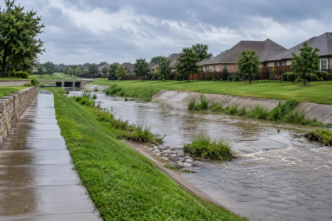 AI-generated scene of a North Texas-style neighborhood and stormwater channel after rain